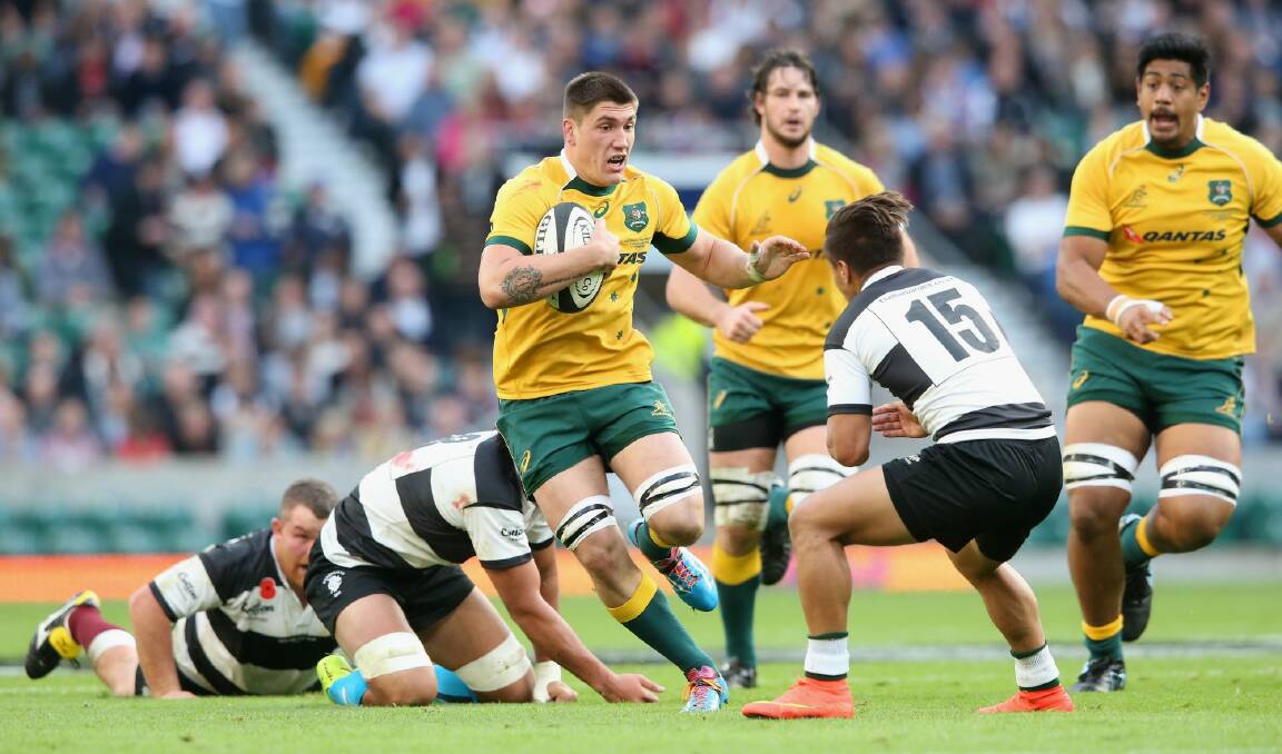 Sean McMahon of Australia breaks with the ball against the Barbarians at Twickenham Stadium. Photo: Getty Images