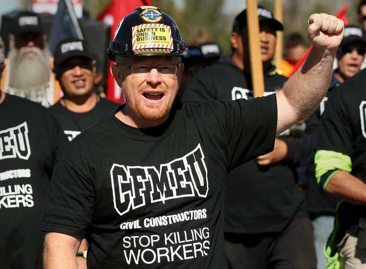 CFMEU secretary Dean Hall leads the National Day of Mourning Rally march. Photo: Jeffrey Chan