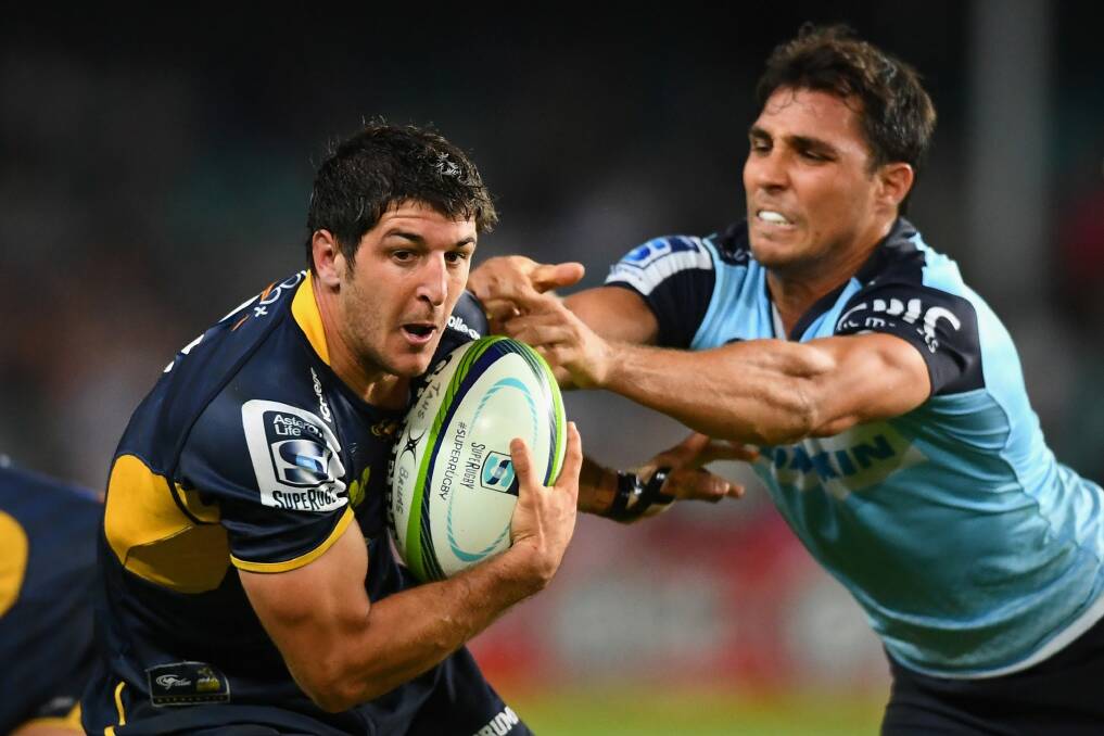 Big improver: Brumbies scrumhalf Tomas Cubelli is tackled by Nick Phipps of the Waratahs. Photo: Getty Images