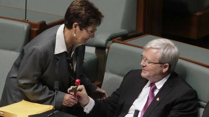 A Parliamentary attendant delivers a Valentines Day chocolate rose from the Opposition to ALP backbencher Kevin Rudd. Photo: Andrew Meares