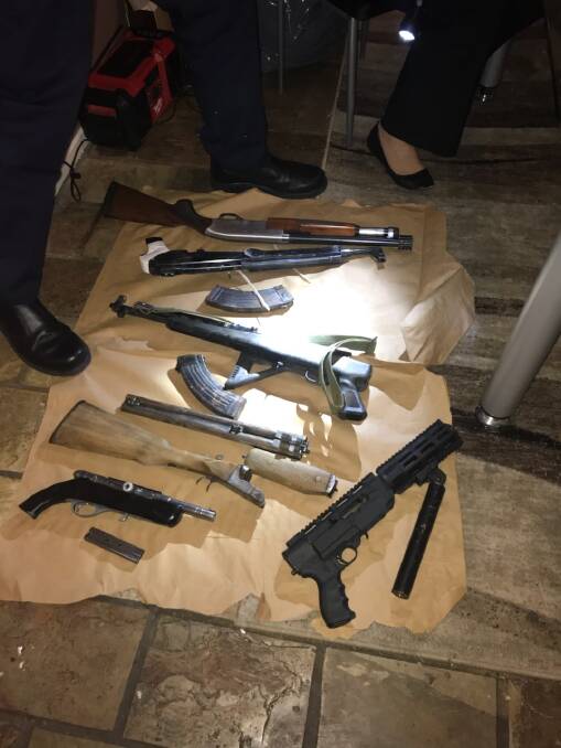 Police seized guns, ammunition and a hand grenade during raids targeting bikie gangs in Canberra. Photo: ACT Policing