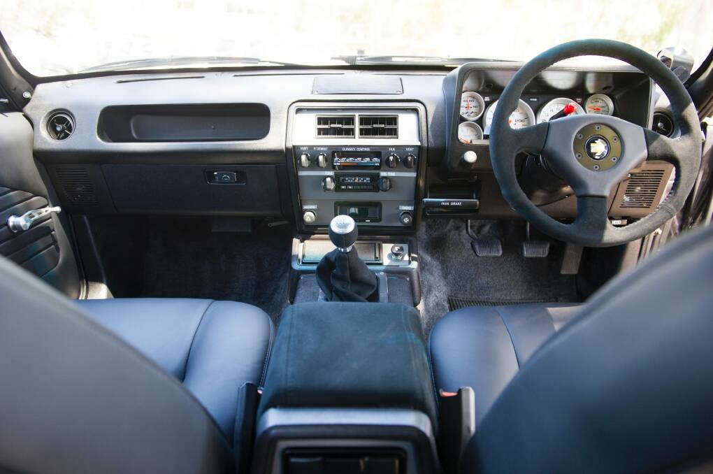 The updated interior, dash, transmission and an original '80s era radio with bluetooth hidden behind it. Photo: Jay Cronan
