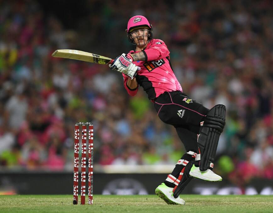 Nic Maddinson hits a six for the Sydney Sixers. Photo: AAP