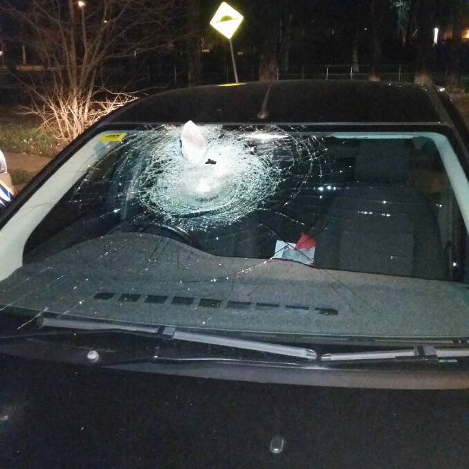 A rock was thrown through a car windscreen in Lyneham in the early hours of Monday morning,