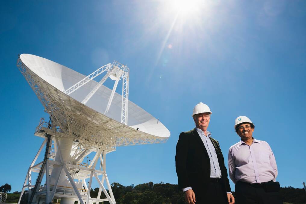 Station Director Ed Kruzins and Network Director Al Bhanji with Deep Space Station 36, the new antenna set to be officially opened on Thursday. Photo: Rohan Thomson