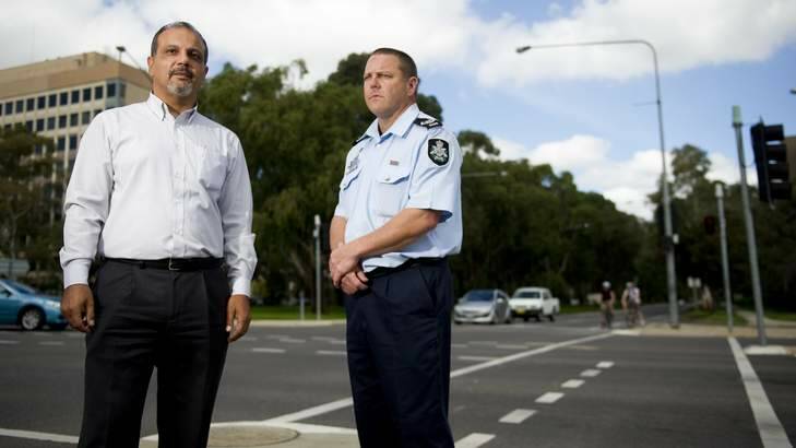 Red light crackdown: Roads ACT senior manager Rifaat Shoukrallah and Sergeant Rod Anderson at one of Canberra's busiest intersection. Photo: Jay Cronan
