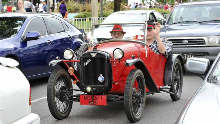 Evatt's Ray Scarlett in the passenger seat of his 1928 Austin 7 Wasp, with son Aaron at the wheel. Photo: Graham Tidy
