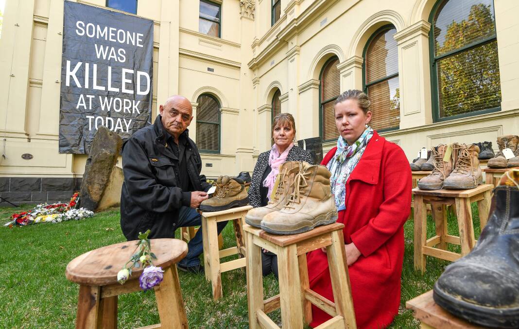 Dave and Janine Brownlee and Lana Cormie, next to the boots of Dave and Janine's son Jack, and the boots of Lana's husband Charlie Howkins at a memorial in Melbourne earlier this year.  Photo: Justin McManus