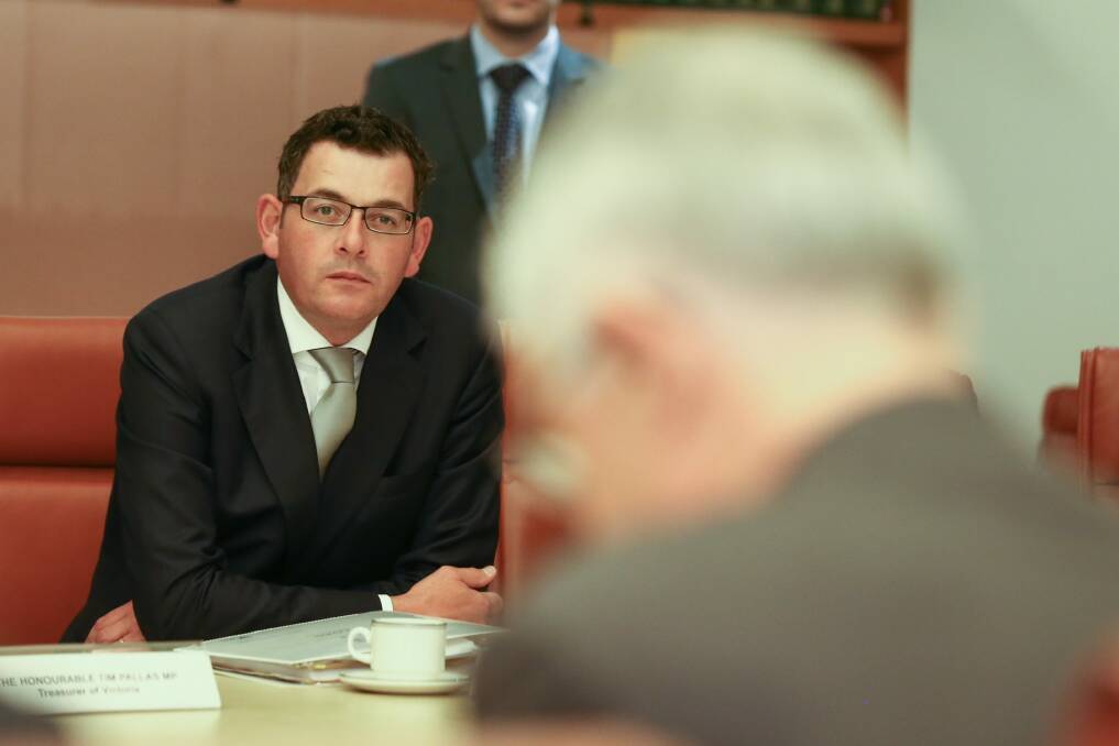 Victorian Premier Daniel Andrews listens as Prime Minister Malcolm Turnbull addresses the Council of Australian Governments meeting. Photo: Alex Ellinghausen