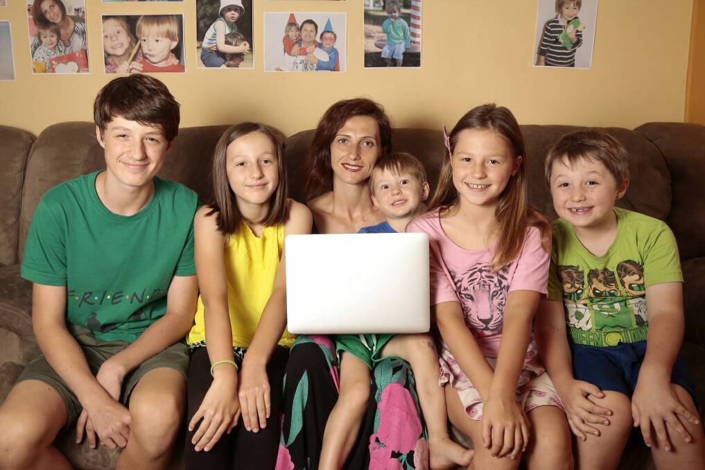 Anna Baroulina of Wanniassa, with children from left, Ivan, 14, Elizabeth, 10, George, 4, Veronica, 9, and Aleksey, 6. Anna is returning to study after 20 years to start a bachelor of midwifery at the University of Canberra. Photo: Jeffrey Chan