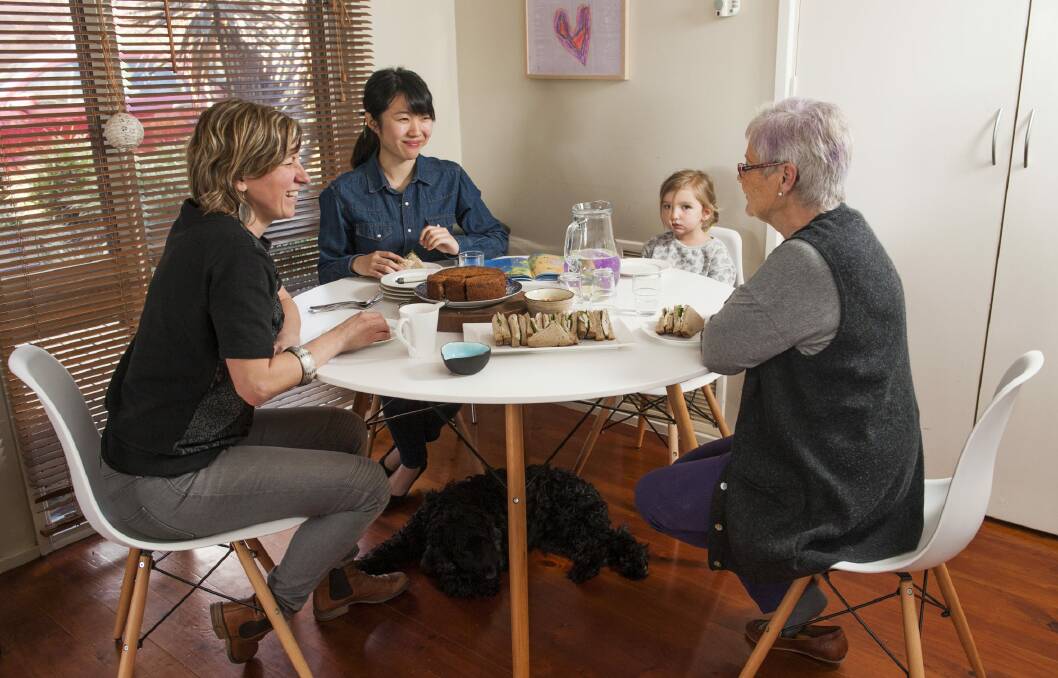 Gemma Sweaney, far left, hosted a welcome lunch as part of The Welcome Dinner Project which aims to join up new arrivals in Australia with residents. Pictured with Mio Itakura, Maggie Sweaney, 4, and Canberra co-ordinator of the project Sue Bromhead. Photo: Elesa Kurtz
