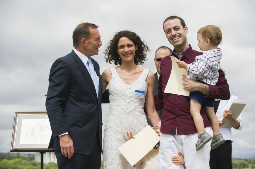 
New Australians are welcomed by Tony Abbott at their citizenship ceremony.


 Photo: Rohan Thomson