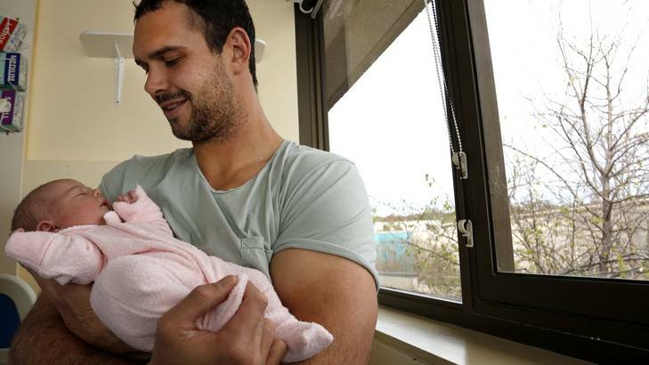 Canberra Raiders player Dane Tilse with his first born baby Ila Rose Tilse born 3.6kg and 49cm at Calvary Hospital. Photo: Jeffrey Chan