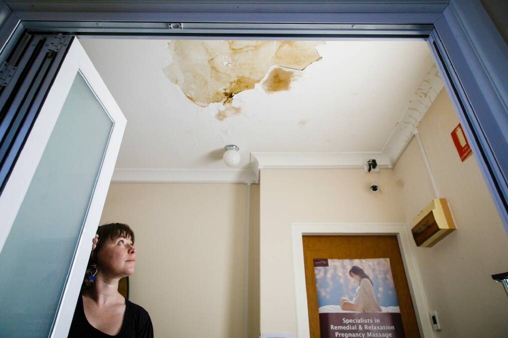 Emma Hely is frustrated by a leaky roof at her business in Ainslie. The building's heritage listing has prevented the building owner from making the repairs neccesary to fix the problem once and for all.  Photo: Sitthixay Ditthavong