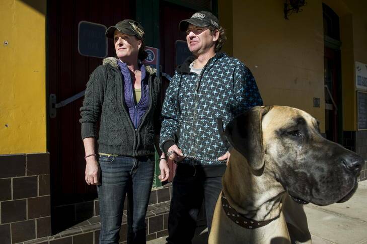 Tony and Kerry, with their dog Maloo, outside the Royal Mail Hotel in Braidwood. Photo: Rohan Thomson
