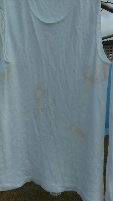 A white singlet stained after washing. Photo: Supplied