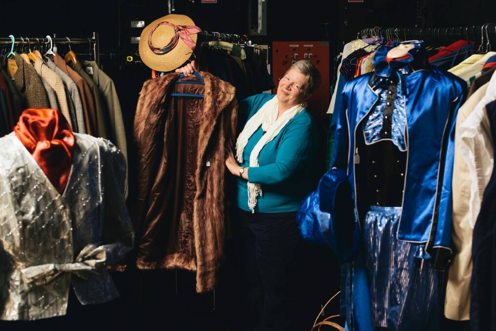 Canberra Repertory Society's Liz de Totth with some of the vintage clothes on sale as part of the society's 85th birthday celebrations. Photo: Rohan Thomson