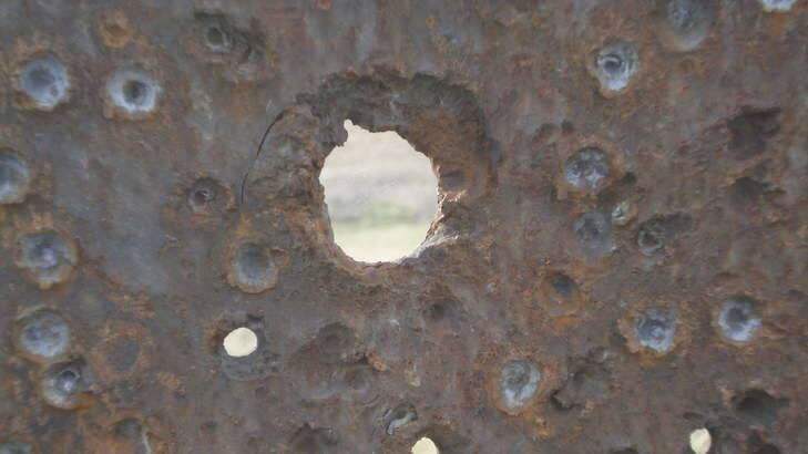 Ouch: This old piece of armour plate at Majura Range has taken a lot of hits.