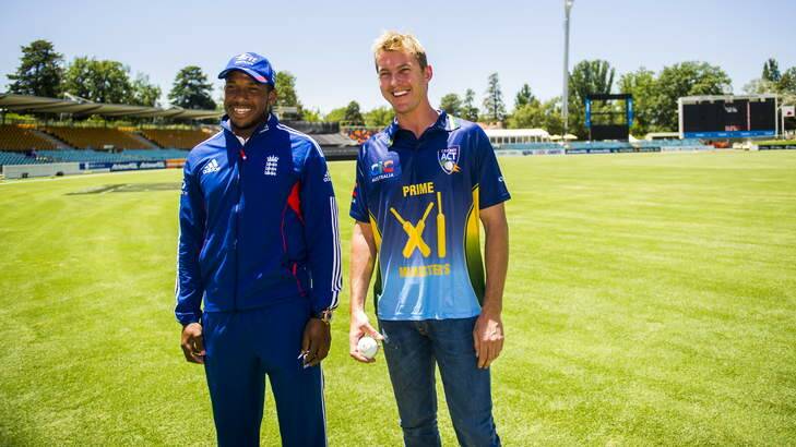PM's XI skipper Brett Lee has a chat with England's Chris Jordan at Manuka Oval on Monday. Photo: Rohan Thomson