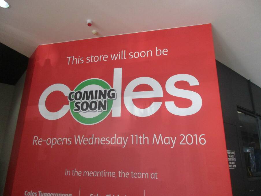 Hoardings have gone up at the entrance to Wanniassa Supabarn which won't reopen until May 11 as it is transformed into a Coles supermarket. Photo: Supplied