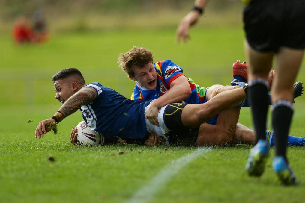 CRL under 23's final at St John Oval, Charlestown. Newcastle, in dark blue, vs Monaro, in light blue and red. Picture shows Newcastle player Willis Alatini, left, and Jack Hickson, right. Photo: Jonathan Carroll