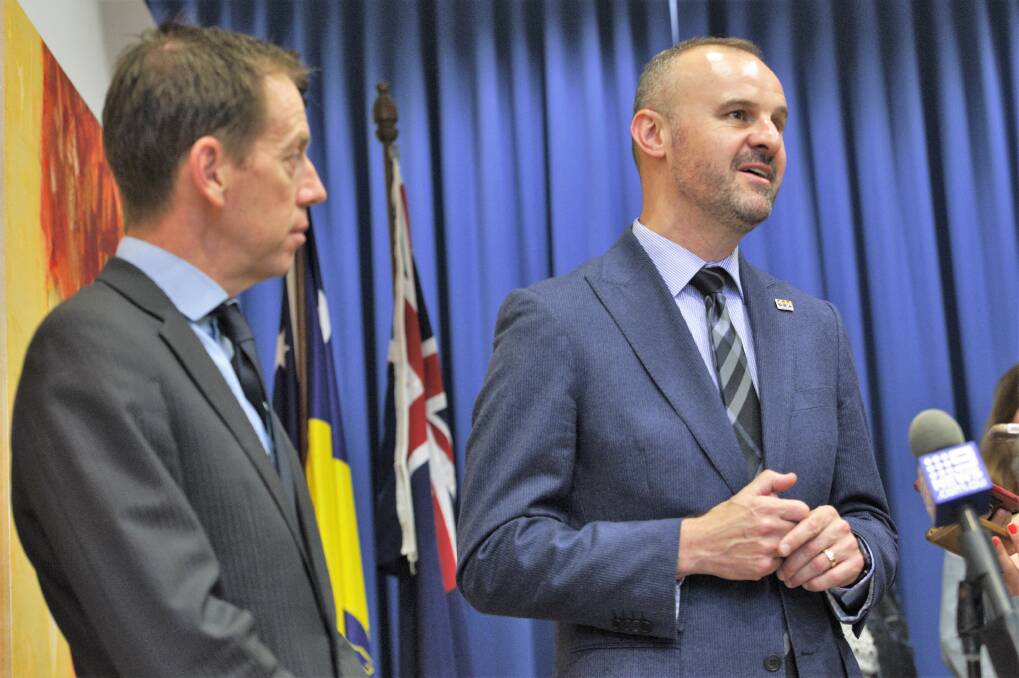 ACT Labor Chief Minister Andrew Barr and Greens Leader Shane Rattenbury discuss the parliamentary agreement on Thursday. Photo: Katie Burgess