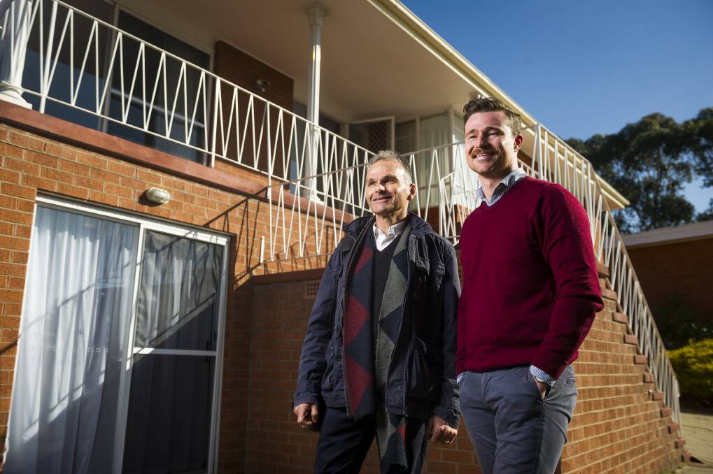 Architects James Gaughwin and Allan Spira discussing plans to transform a Farrer home. They are searching for people who want to convert their McMansions into two or three apartments under the same roof.  Photo: Dion Georgopoulos