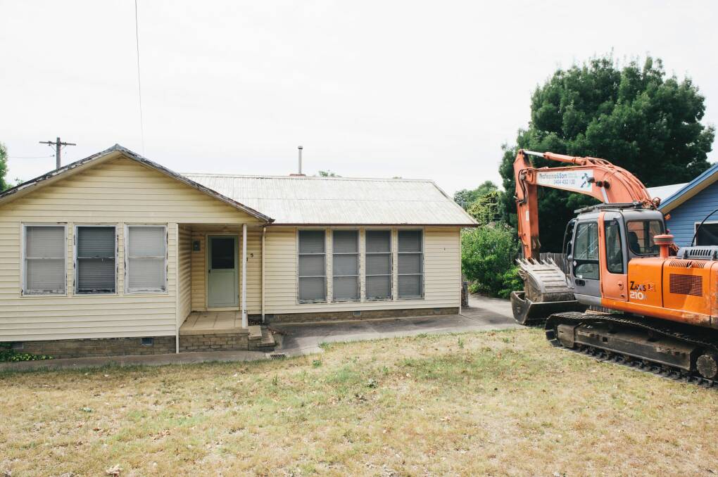 Demolition equipment was parked outside the Mr Fluffy home.  Photo: Rohan Thomson