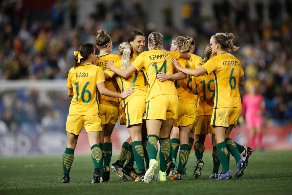Good as gold: Matildas players celebrate Sam Kerr's goal against Brazil in Newcastle last month. Photo: AAP