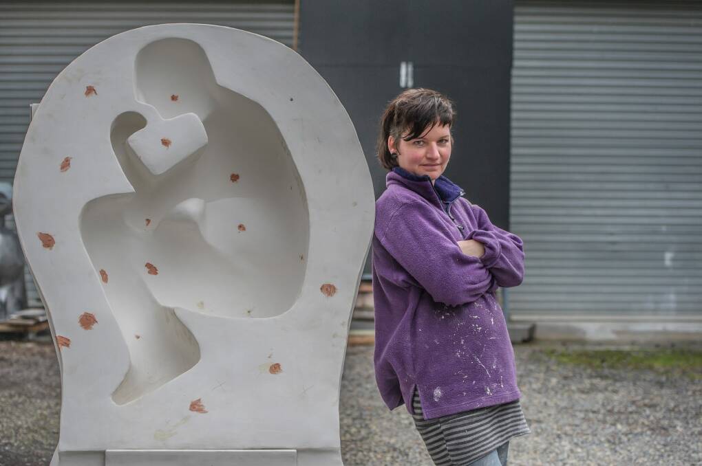Canberra sculptor Hanna Hoyne, whose work is being featured in Sculpture by the Sea at Bondi this year, working on her piece in her Mitchell workshop. Photo: Karleen Minney