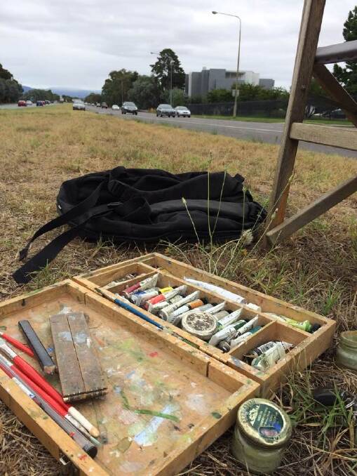 Canberra artist Christopher Oates' tools of his trade in his unusual workspace - the middle of Adelaide Avenue - on Wednesday. Photo: Megan Doherty