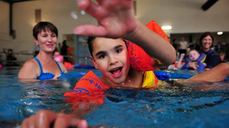 The opening of the new $3.05million hydrotherapy pool at Malkara School, Slade Jacky enjoys his time in the pool, Garran. Photo: Colleen Petch
