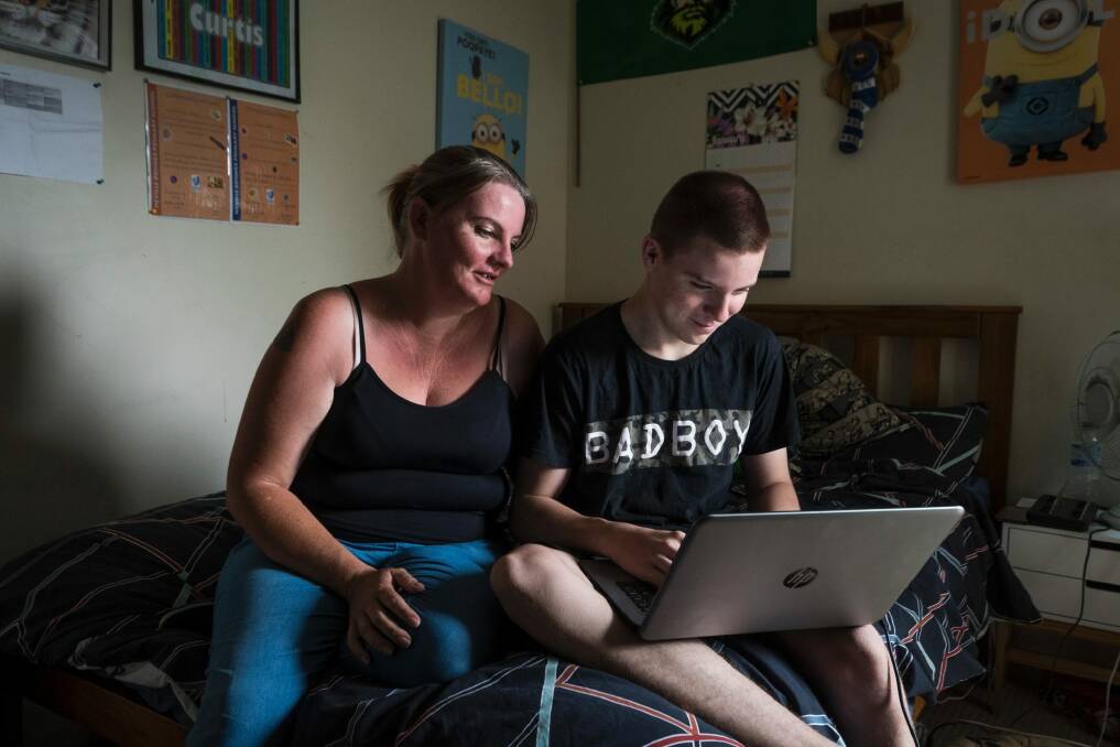 Roseanna Harris with her son Curtis Edward Harris, 14, who will finally be receiving a laptop from the government for the upcoming school year.  Photo: Dion Georgopoulos