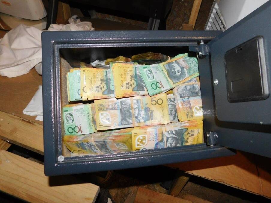 A safe containing $377,905 in cash was found hidden under the Phillip home of Chang-Kee Song.  Photo: Supplied