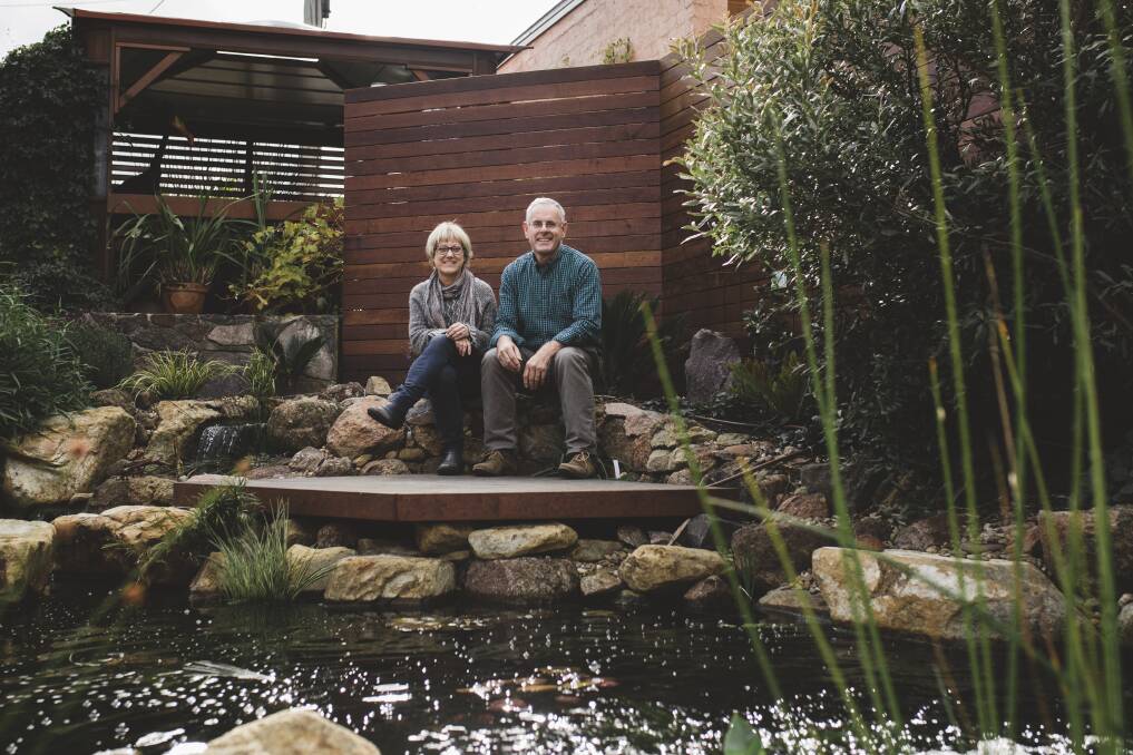 Christine and Warwick Finch in their garden. A series of open gardens will be held across the ACT and region to demonstrate best practice solutions for managing and treating stormwater and minimising contaminated run-off. Photo: Jamila Toderas