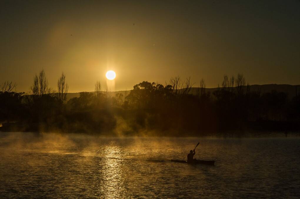 A kayaker out in the early morning on Lake Burley Griffin. Photo: Karleen Minney