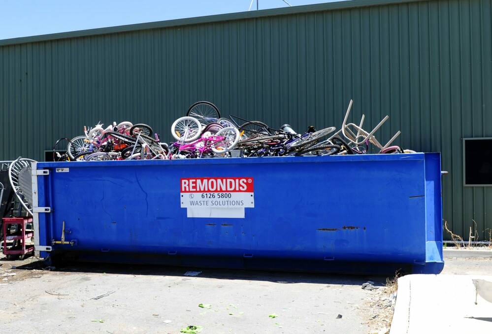 Bikes start to pile up in a skip at the Green Shed at Mugga Lane Resource Management Centre in Symonston. Photo: Melissa Adams
