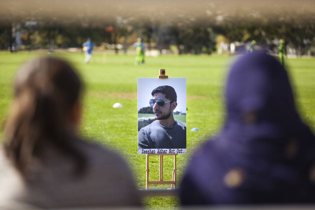 Family and friends watch the memorial match played in the memory of Zeeshan Akbar. Photo: Olia Balabina 