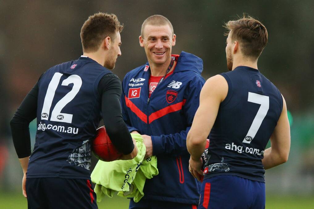 Simon Goodwin with young Demons Dom Tyson and Jack Viney Photo: Getty Images