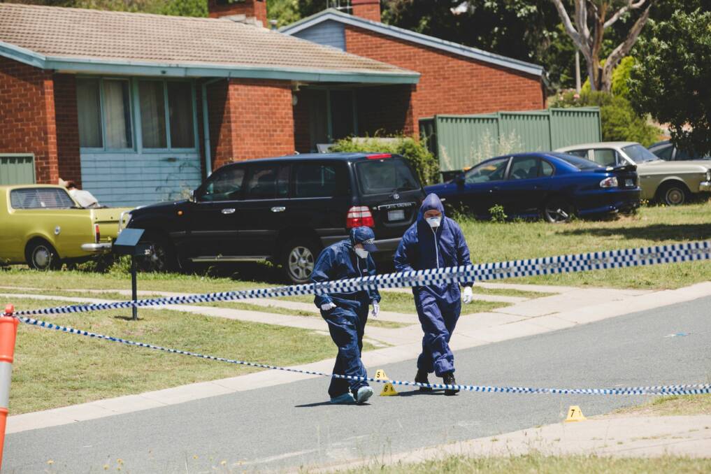 Forensics officers at Goodenia Street, Rivett, after Bobby Allan was found dead. Photo: Jamila Toderas