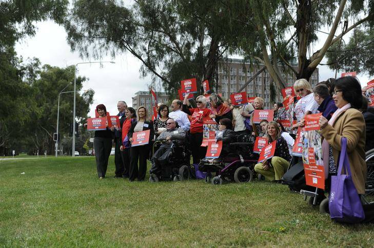 Crowd of disability advocates show their support for the National Disability Insurance Scheme at a national 'Make it Real' rally opposite the Canberra Rex Hotel. Photo: Jay Cronan