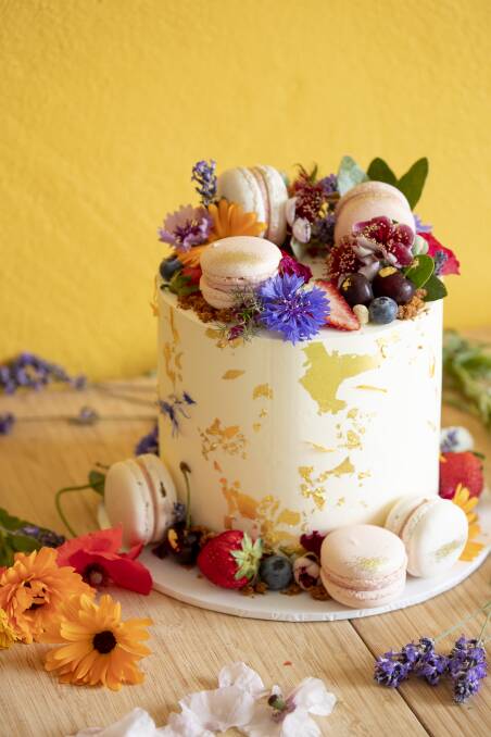 Tropical Coconut and Raspberry Cake from The Dessert Jar with edible flowers grown by Astrid. Photo: Sitthixay Ditthavong