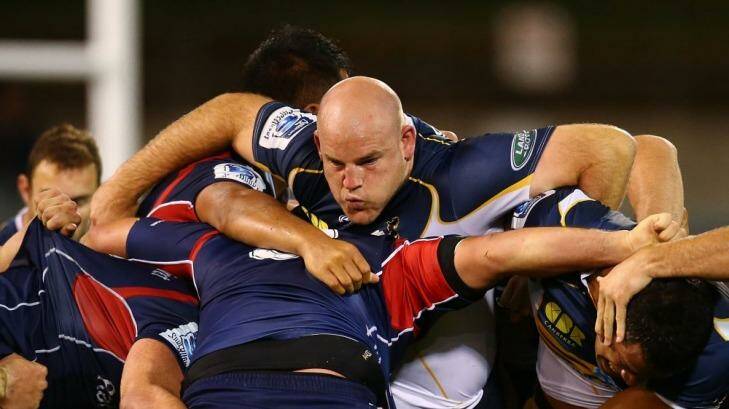 Stephen Moore takes on the Rebels'  pack on Saturday night. Photo: Getty Images