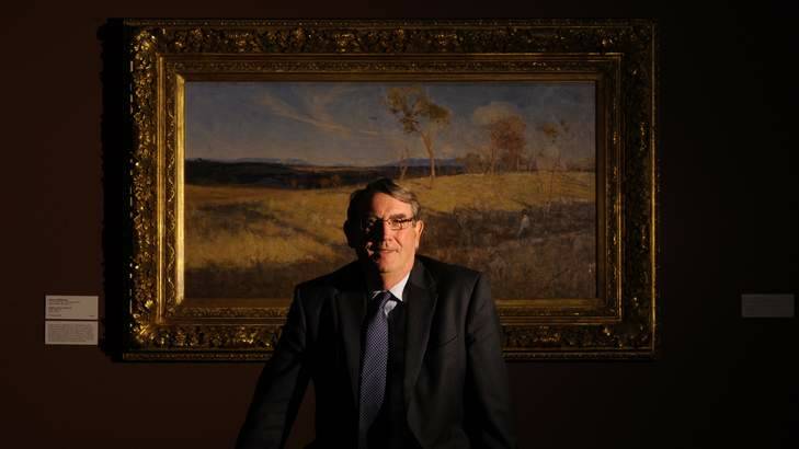 John Hindmarsh with Arthur Streeton's <i>Golden Harvest</i> at the National Gallery of Australia. Photo: Lannon Harley