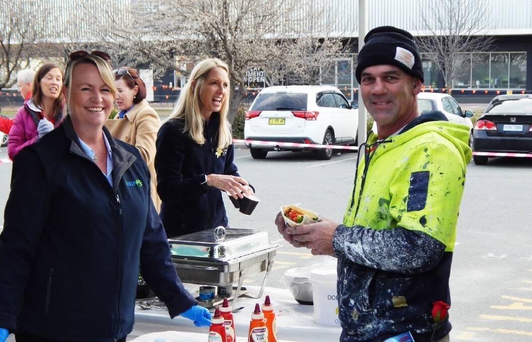 OzHelp threw a free barbecue for Canberra tradies to celebrate Tradies Health Month at Bunnings Tuggeranong on Wednesday morning. Photo: Supplied
