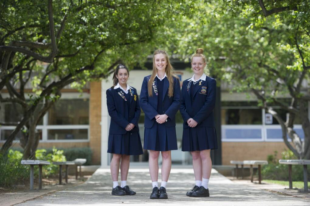 Merici College students Tahlia Low, Grace Cooper and Rose Mackay. Photo: Jay Cronan