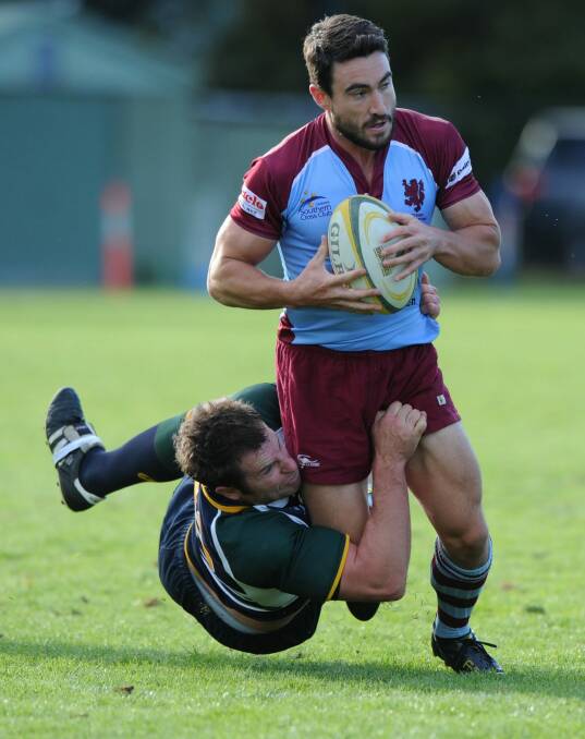 Sasha Mielczarek, who won the heart of The Bachelorette Sam Frost, goes in for a killer tackle playing for Uni-Norths rugby team in Canberra in 2012 Photo: Graham Tidy