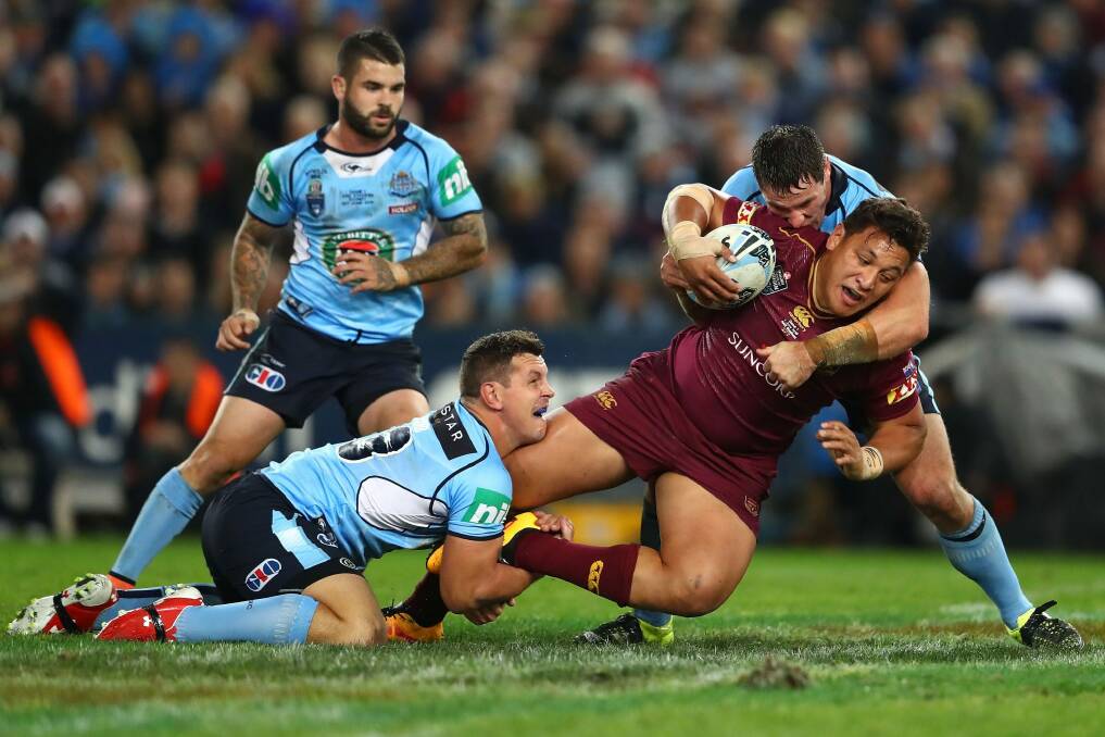 Queensland's Josh Papalii is tackled during Game 1 of the  2016 State of Origin series. Photo: Getty Images
