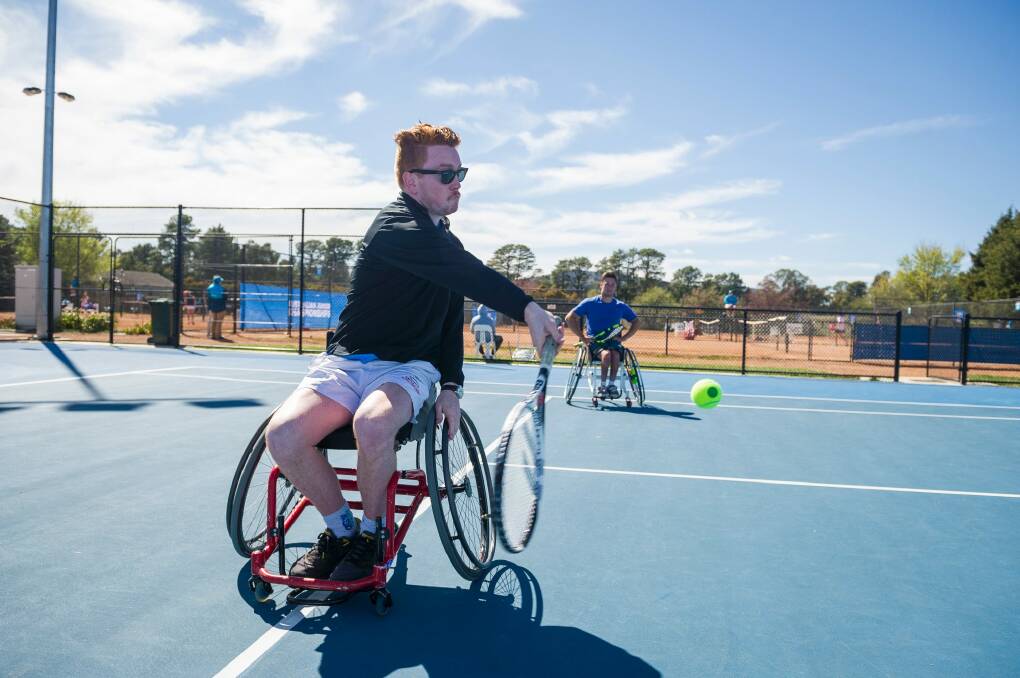 Our sports journalist Eamonn Tiernan had a crack at wheelchair tennis with Australian number two Stephan Rochecouste.  Photo: Dion Georgopoulos