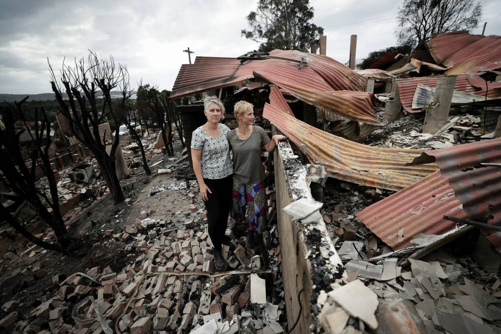 Deborah Naeve and partner Ingrid Mitchell return to their home in Tathra which was burned down in the bushfire on the NSW south coast. Photo: Alex Ellinghausen